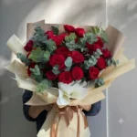 A Bouquet of Red Roses and Eucalyptus