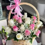 A Basket of White Roses and Flowers with Charming Gypsophila Blossoms